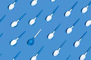 Pattern of withe spoon on blue background. photo