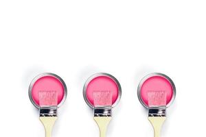 White background with pink paint jars. photo