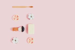 Zero waste accessories on pink background. photo