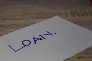 A paper with the words Loan photo