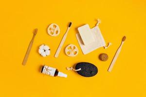 Zero waste accessories on yellow background. photo