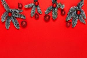 Christmas background with red balls on fir brunches. photo