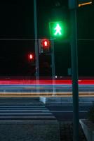 Red and Green pedestrian Crossing Signal On photo