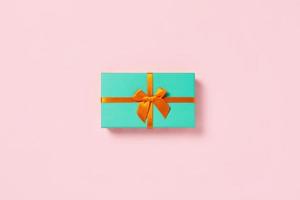 Mint gift box on a pink background. photo