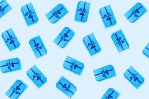 Blue gift boxes on a color background. photo