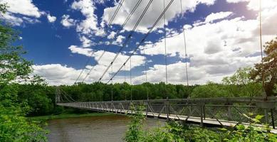 suspended cable-stayed bridge over the Neman river photo