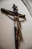 crucifix with jesus placed in church photo