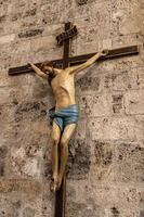 crucified on the wall of a church