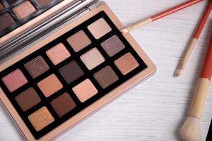 Eye shadow palette with makeup brushes, lifestyle stagging photo