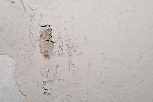 Water damaged ceiling roof in an old house. Water damage building interior. Ceiling house broken. Ceiling concrete crack and exposed the rusty steel bar frame. photo