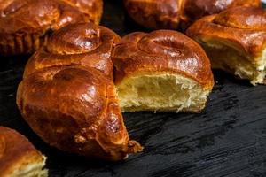 Fresh bread from the oven. Traditional cheese pie from Romania called Saralie. Homemade bread made from white wheat flour. photo