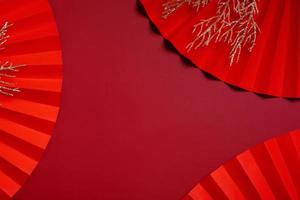 Red paper fans symbol Chinese new year top view with copy space photo