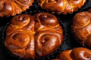 Fresh bread from the oven. Traditional cheese pie from Romania called Saralie. Homemade bread made from white wheat flour. photo