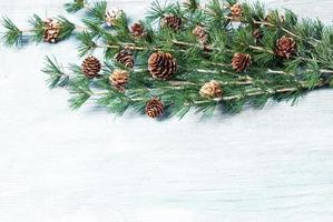 New Year or New Year's Eve background with fir branch with cones. The year 2023 is coming. photo