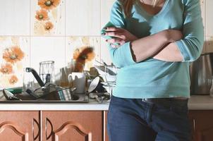 Fragment of the female body at the kitchen counter, filled with photo