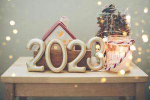 Numbers 2023 on with festive Christmas decor. Happy New Year 2023. Greeting card. photo