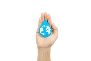 Hands holding water drop paper cut, Washing hand, Hand sanitizer and Hygiene for covid pandemic. World water day, Save water, Renewable energy concept. photo