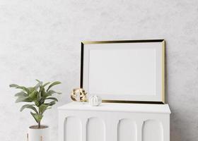 Empty picture frame standing on white console in modern living room. Mock up interior in minimalist, scandinavian style. Free space for picture. Console, plant, vase. 3D rendering. photo