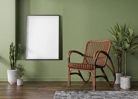 Empty vertical picture frame on green wall in modern room. Mock up interior in scandinavian, boho style. Free, copy space for your picture. Rattan armchair, plants. 3D rendering. photo