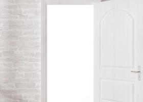 Opened door in empty white room. Copy space. Template to integrate your picture, text. Close up view. 3D rendering. photo