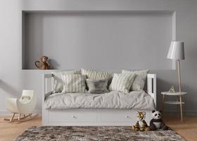 Empty gray wall in modern child room. Mock up interior in scandinavian style. Copy space for your picture or poster. Bed, toys. Cozy room for kids. 3D rendering. photo