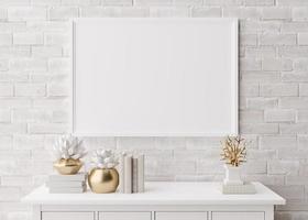 Empty horizontal picture frame on white brick wall in modern living room. Mock up interior in minimalist, scandinavian style. Free, copy space for picture, poster. Console, sculptures. 3D rendering. photo