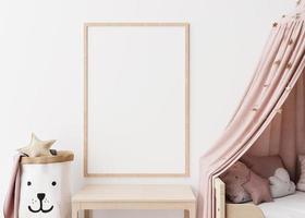 Empty vertical picture frame on white wall in modern child room. Mock up interior in scandinavian style. Free, copy space for your picture. Close up view. Cozy room for kids. 3D rendering. photo