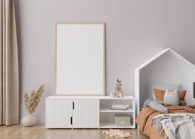 Empty vertical picture frame on cream wall in modern child room. Mock up interior in scandinavian style. Free, copy space for your picture. Bed, console, pampas grass. Cozy room for kids. 3D rendering photo