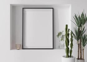 Empty vertical picture frame on white wall in modern living room. Mock up interior in contemporary, scandinavian style. Free, copy space for picture. Plants, candle. Close up. 3D rendering. photo