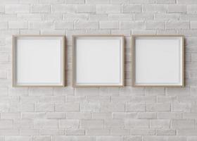 Three blank square picture frames hanging on white brick wall. Template, mock up for your picture or poster. Copy space. 3D rendering. photo