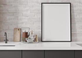 Empty vertical picture frame standing in modern kitchen. Mock up interior in minimalist, contemporary style. Free, copy space for your picture, poster. Close up view. 3D rendering. photo