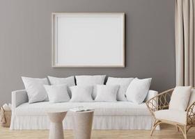 Empty horizontal picture frame on grey wall in modern living room. Mock up interior in scandinavian, boho style. Free, copy space for your picture, poster. Rattan armchair, sofa. 3D rendering. photo