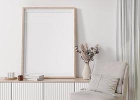 Empty vertical picture frame on white wall in modern living room. Mock up interior in contemporary, scandinavian style. Free, copy space for picture. Console, pampas grass. Close up. 3D rendering. photo