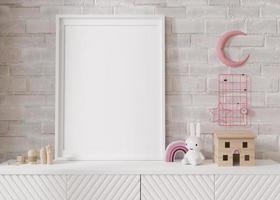 Empty vertical picture frame standing on white sideboard in modern child room. Mock up interior in scandinavian style. Free, copy space for your picture, poster. Close-up view. 3D rendering. photo