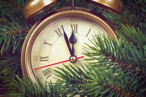 Christmas clock and fir branches photo