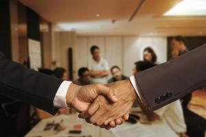 Business partnership meeting concept. Image businessmans handshake. Successful businessmen handshaking photo