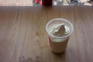 Selective focus ice cream with plastic cup photo