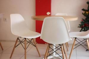 Empty chairs and tables at an ice cone shop photo