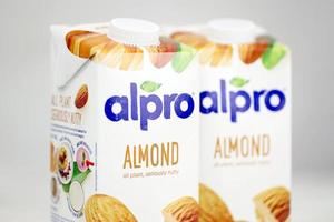 KHARKOV, UKRAINE - JULY 2, 2020 Alpro almond and hazelnut milk packs produced by European company from Wevelgem, Belgium photo