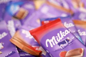 KHARKOV, UKRAINE - DECEMBER 8, 2020 Many wrappings of purple Milka chocolate. Milka is a Swiss brand of chocolate confection manufactured by company Mondelez International photo