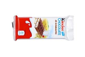 KHARKOV, UKRAINE - DECEMBER 8, 2020 Cereals by Kinder brand made by Ferrero SpA. Kinder is a confectionery product brand line of multinational manufacturer Ferrero photo