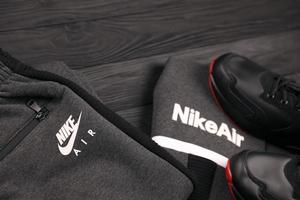KHARKOV, UKRAINE - DECEMBER 20, 2020 Nike brand clothes and shoes sport wear kit. Nike is American multinational corporation engaged in manufacturing and worldwide marketing of clothes and footwear photo
