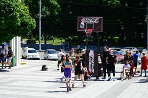 KHARKIV, UKRAINE - 27 MAY, 2018 Women's teams play streetball in the open air during the annual festival of street cultures photo