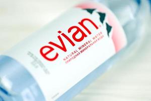 KHARKOV, UKRAINE - JULY 2, 2021 Bottle Of Evian Natural Mineral Water. Evian bottling factory located in Amphion, France photo