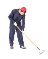 Gardener with garden tools on white photo