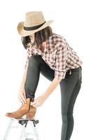 Young woman in a plaid shirt posing in studio on white background photo