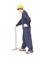 Man in uniform hold old pick mattock that is a mining device photo