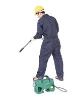 Young man stand and holding high pressure water gun photo