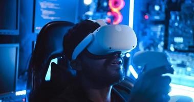 A hacker wearing virtual reality glasses is using computer to hack data to get ransom from victims. photo