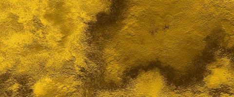 digital painting of gold texture background on the basis of paint. dark black yellow golden stone concrete paper texture. old brown paper background with texture. watercolor background with grunge. photo